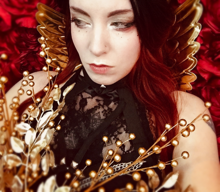goth goddess in golden floral and wings