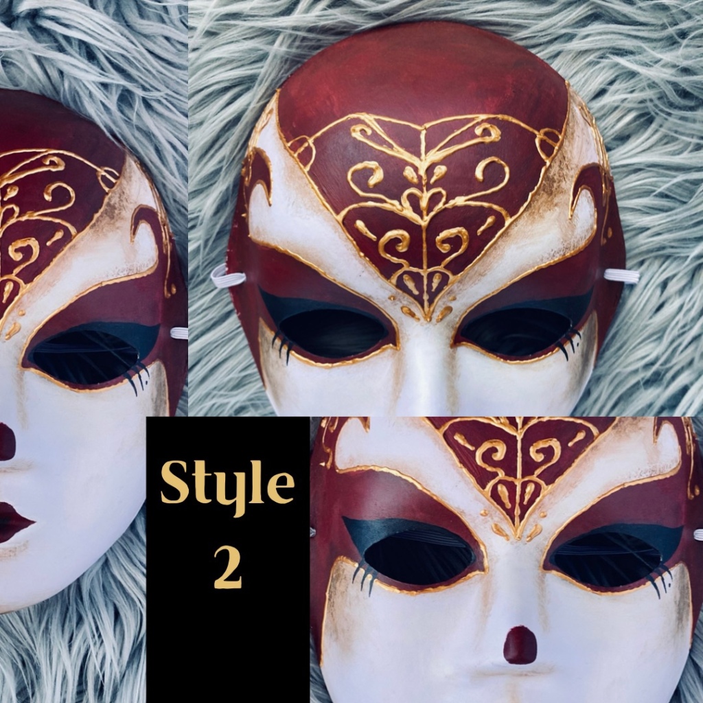Ornate, detailed handmade ball mask, featuring red acrylic paint and gold relief detailing. 